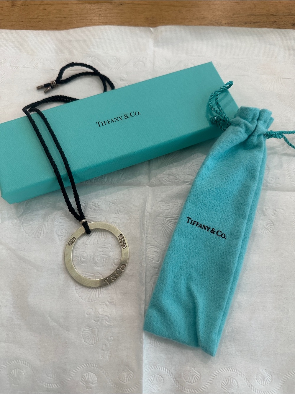 Tiffany & Co. Silver Circle Pendant with Black Cord and Tiffany Blue Pouch